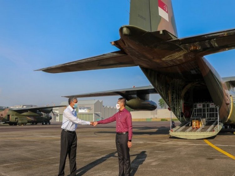 Singapore Minister flags off two C-130s with 256 oxygen cylinders for India