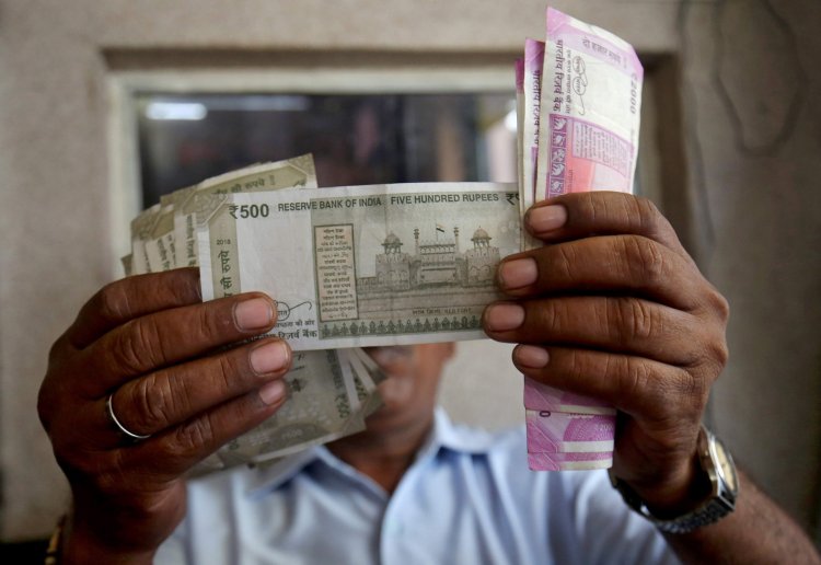 Rupee slips 5 paise to close at 74.79 against US dollar