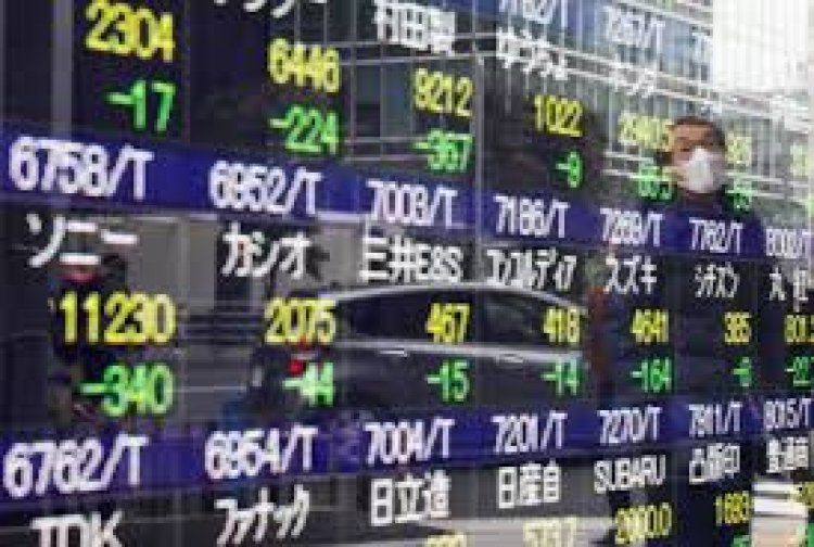 Asian shares mostly lower after tepid gains on Wall Street