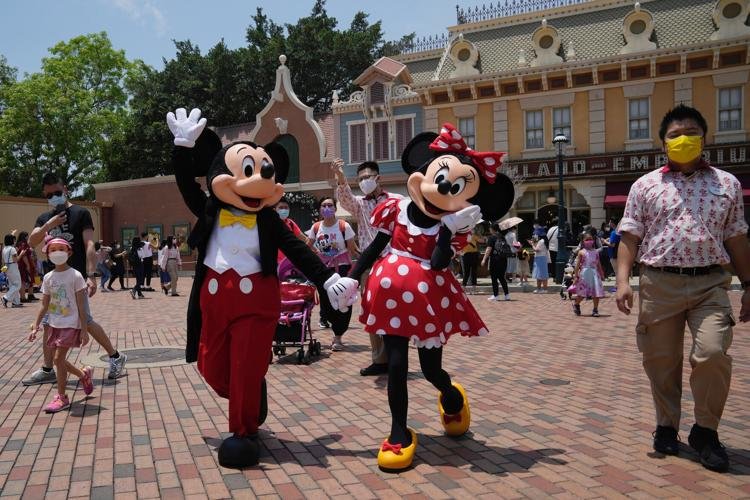 Hong Kong Disney opens as Covid cases ease; Shanghai deaths rise