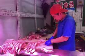 China releases stockpiled pork to cool price surge