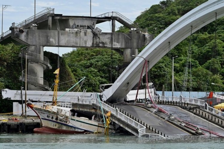 Rescuers fear six people may be trapped in Taiwan bridge collapse
