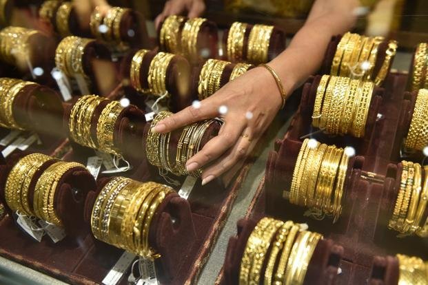 Gold up marginally by Rs 5, silver falls Rs 91