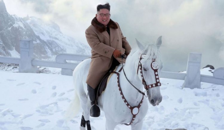 Kim vows to fight US sanctions, visits sacred N Korean peak