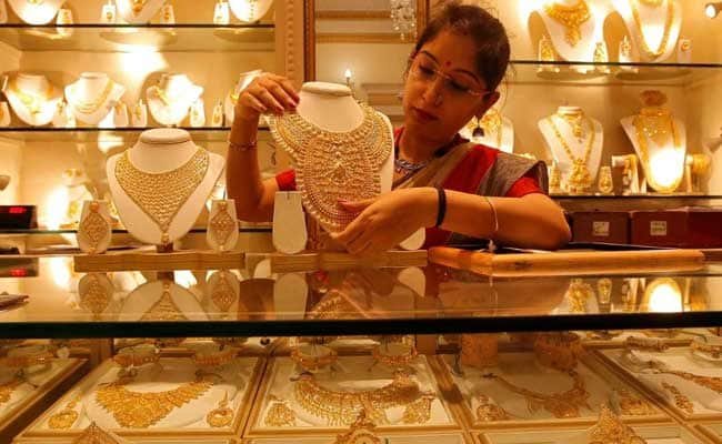 Gold falls Rs 105 on stronger rupee, weak cues