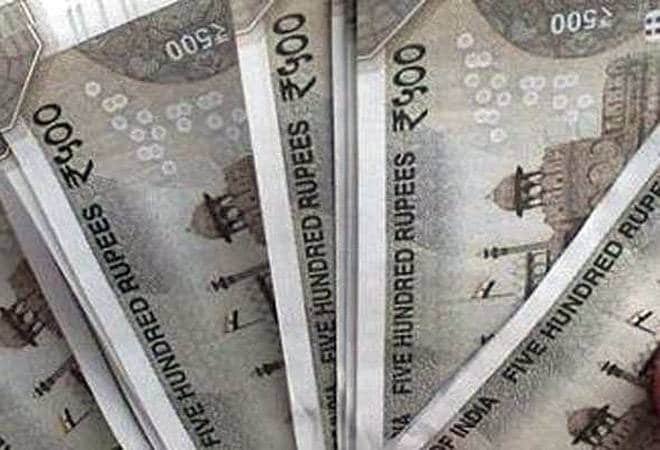 Rupee settles 12 paise higher at 70.90 against US dollar