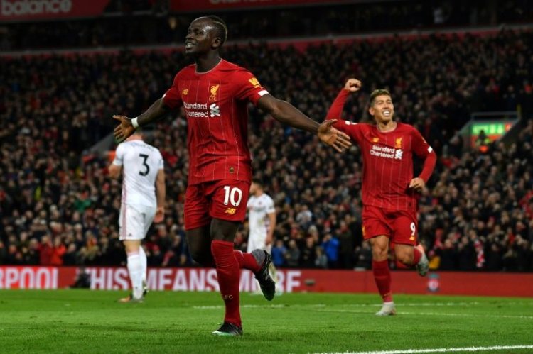 Liverpool march towards history as top-four race heats up