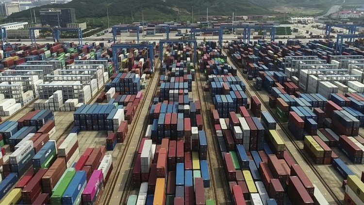 China's export growth quickens in August, imports edge lower