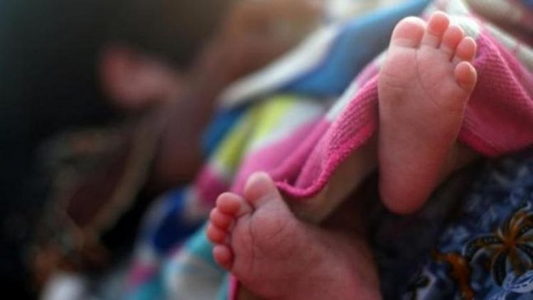 Newborn's body exhumed, parents detained