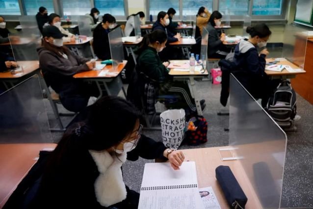 S Korean students take exams amid viral spike