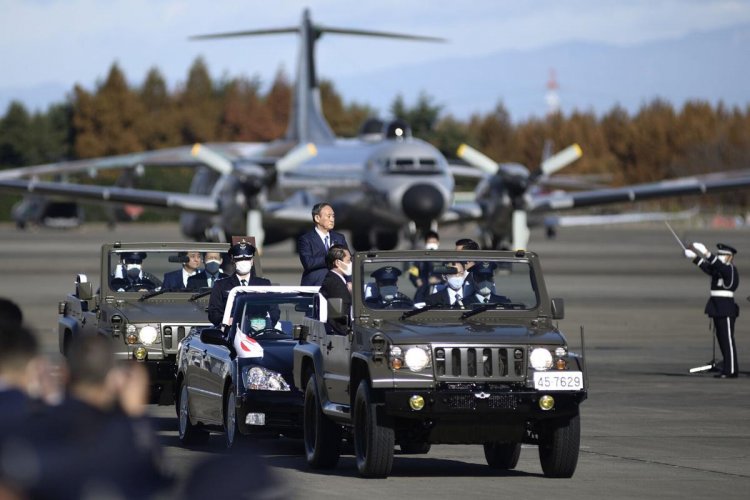 Japan Cabinet OKs more defense funds amid potential threats