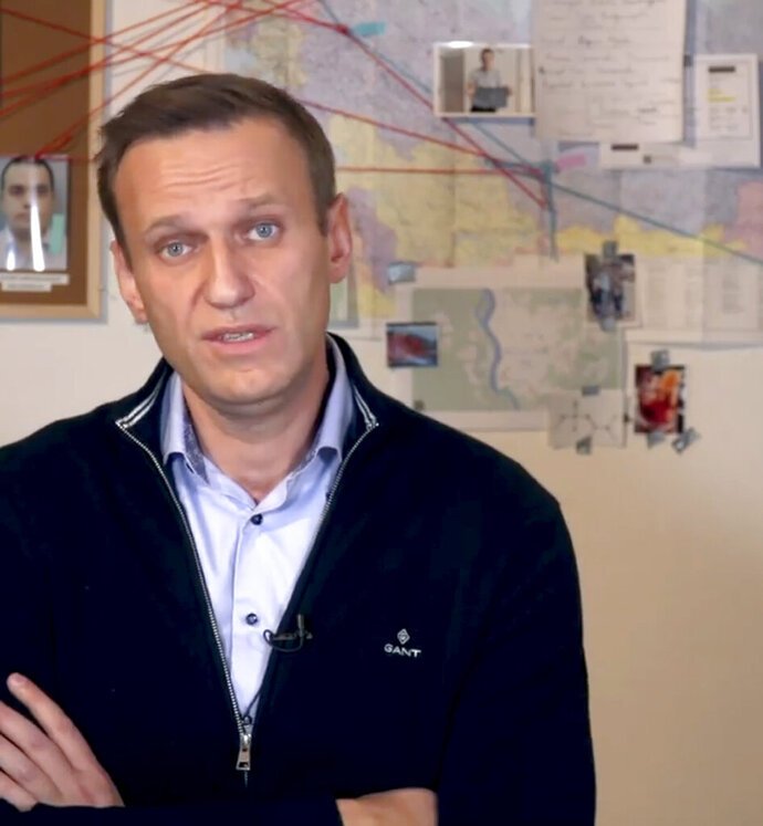 Russia's prison service tells Navalny to appear or face jail