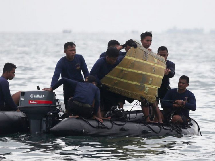 Indonesia intensifies search for crashed plane's black boxes