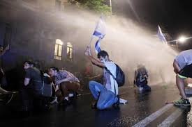 Israeli police use water cannon to disperse anti-PM crowd